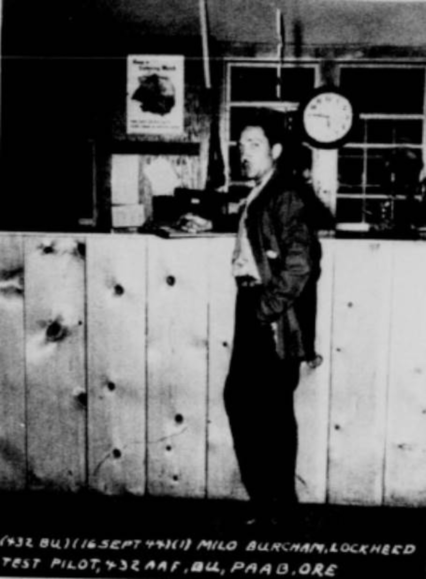 Pictured here is Milo Burcham, Lockheed’s ace test pilot, as he stands at the counter of PAAB’s operations building.  On September 16, 1944, Burcham, flying a P-38 with incredible ease and skill, put his ship through some of the most difficult maneuvers in flying in a flight over the Portland Army Air Base.  Besides being tremendously exciting, his flight proved to be an invaluable source of inspiration to the pilot trainees of the 432nd Army Air Force Base Unit who would soon be flying P-38’s exclusively.  He demonstrated the peak performance that the P-38 could attain.  (U.S. Air Force photo)