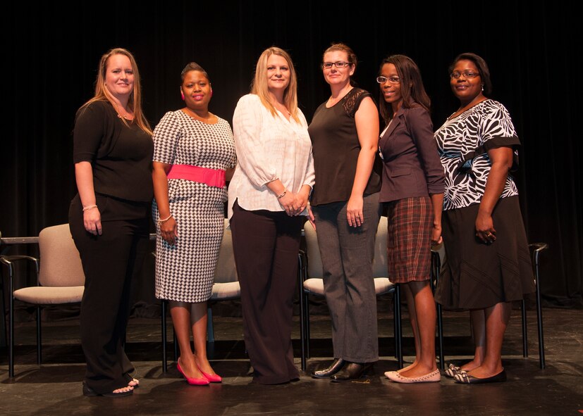 Spouses from Team Barksdale pose for a photo during the certified nurse assistance graduation at Bossier Parish Community College Dec. 5, 2014. The Airman and Family Readiness Center won a grant to fund the CNA program for four spouse's at BPCC. (U.S. Air Force photo/Senior Airman Joseph A. Pagán Jr.)