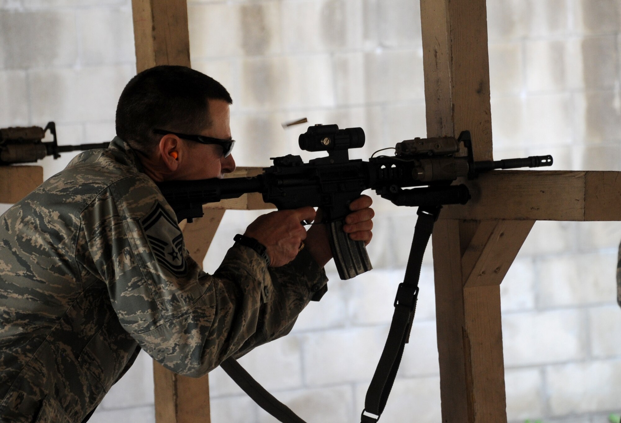 U.S. Air Force Senior Master Sgt. James Zuehlke, 927th Air Refueling Wing Security Forces operations superintendent shoots an M-4 rifle at the shooting range on Jan. 7, 2015 at MacDill Air Force Base, FL. Zuehlke was shooting to remain mission ready. (U.S. Air Force photo/Senior Airman Xavier Lockley) 