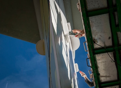 The Lockheed C-141 Starlifter receives a fresh set of paint Jan. 7th, 2015, at Joint Base Charleston – Air Base, S.C. The aircraft was stripped to its metal exterior and received coatings of primer prior to being painted to its original white-grey tone. (U.S. Air Force photo / Senior Airman Tom Brading)