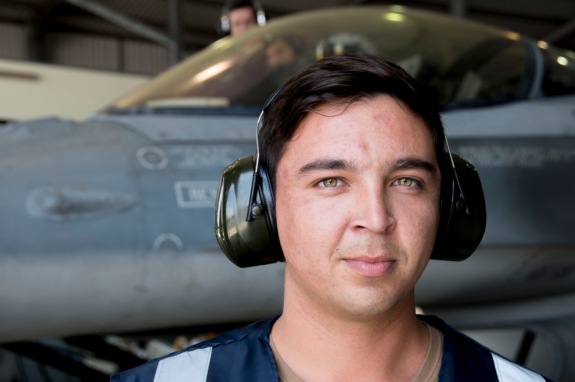 A member of the Fuerza Aérea de Chile (Chilean air force) smiles during preflight function checks on Dec. 03, 2014. Members of Air Forces Southern embarked on a four week journey, which corresponded with United States Southern Command’s priorities of building partner capacity through sustained engagement and provided AFSOUTH Airmen with firsthand experience at assisting in building partner capacity. (U.S. Air Force photo by Staff Sgt. Adam Grant/Released)
