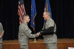 Air Force Chief of Staff Gen. Mark A. Welsh III (right) presents a CSAF coin to Airman 1st Class Lane Rabern for his contributions to the Air Force mentoring program Dec. 9 at Joint Base San Antonio-Randolph. (U.S. Air Force photo by Joel Martinez)