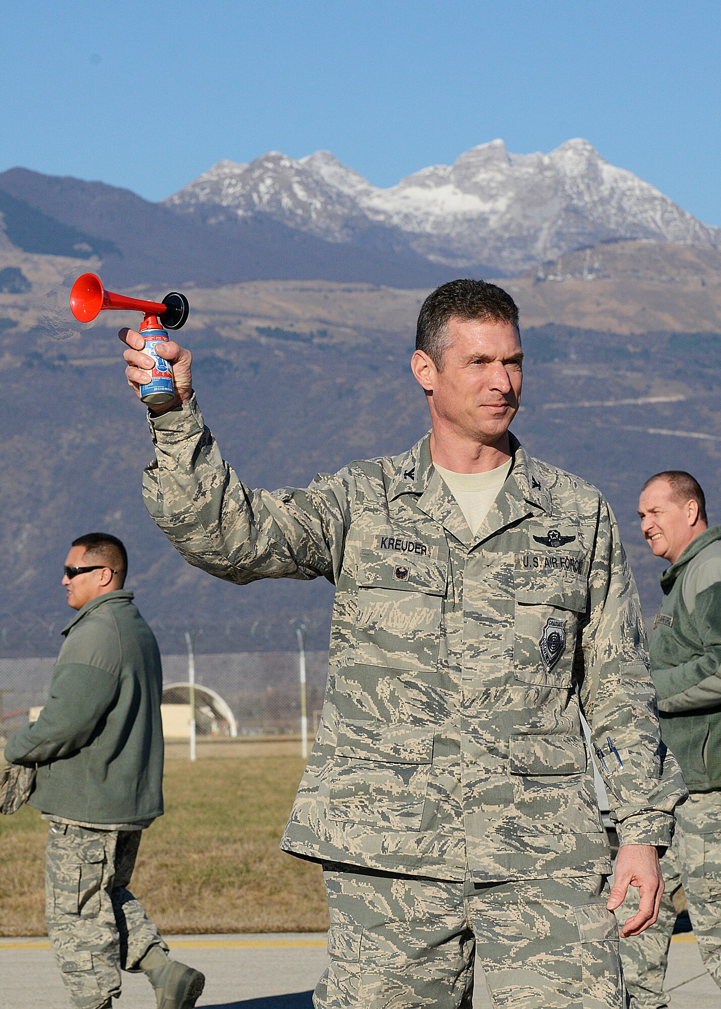 U.S. Air Force Col. Gregory Kreuder, 31st Fighter Wing vice commander, sounds the horn to start a quarterly weapons load competition, Jan. 6, 2015, at Aviano Air Base, Italy. Load crew competitions ensure Airmen maintain their skills while promoting competition and camaraderie among the squadrons. (U.S. Air Force photo/Airman 1st Class Ryan Conroy) 