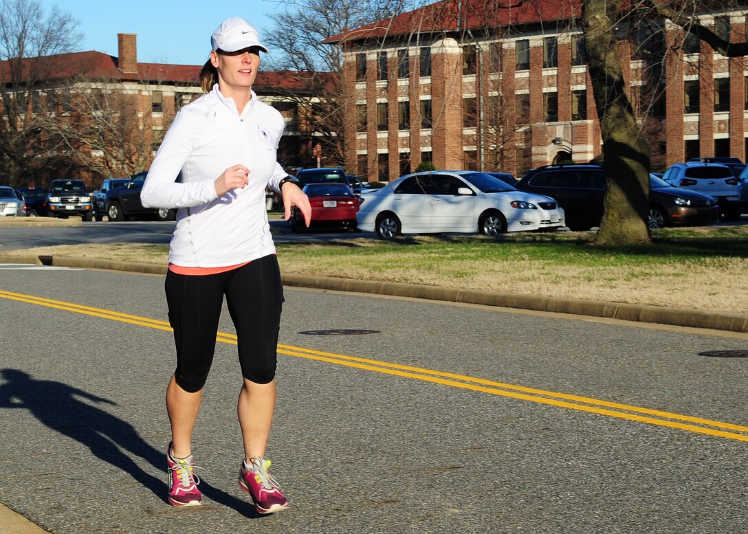 U.S. Air Force Master Sgt. Ami Parrish, 1st Maintenance Squadron, unit education and training manager, runs in preparation for a marathon at Joint Base Langley-Eustis, Va., Jan. 5, 2015. As part of her New Year’s resolution, Parrish is training to run in an ultra-marathon and the Raleigh Half Iron Man Triathlon. She has been competitively running for the last two years and participated in three marathons since July 2014. (U.S. Air Force photo by Airman 1st Class Breonna Veal/Released) 
