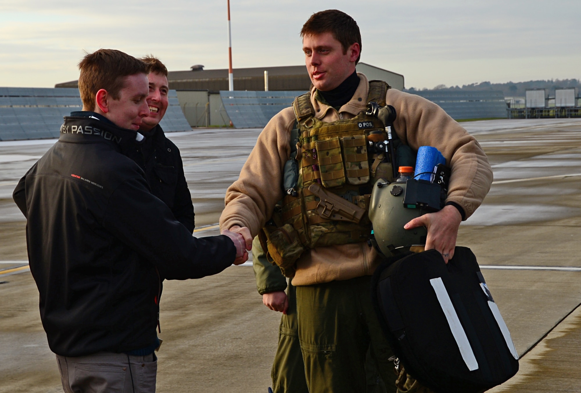 Liam Buckley, a 22-year-old British local from Sheffield, meets a helicopter pilot from the 56th Rescue Squadron during a Pilot for a Day visit at Royal Air Force Lakeneath, England, Dec. 30, 2014. The program allows children with serious illnesses to engage with aircrew and to experience the life of an Air Force pilot for the day. (U.S. Air Force photo by Senior Airman Erin O’Shea/Released) 
