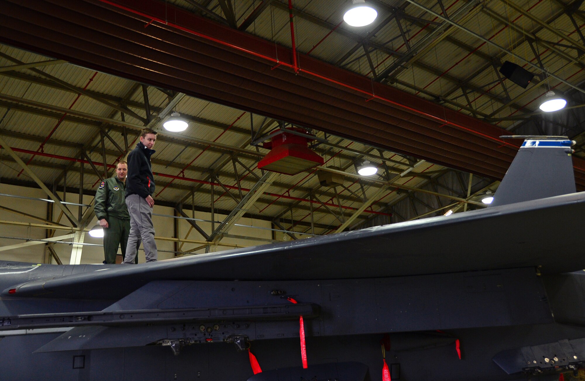 Liam Buckley, a 22-year-old British local from Sheffield, stands on a 492nd Fighter Squadron F-15E Strike Eagle with pilot 1st Lt. Joshua Judy during a Pilot for a Day tour at Royal Air Force Lakenheath, England, Dec. 30, 2014. Buckley dreams of becoming a pilot and recently finished his degree in Aerospace Engineering at Sheffield Hallum University. (U.S. Air Force photo by Senior Airman Erin O’Shea/Released) 