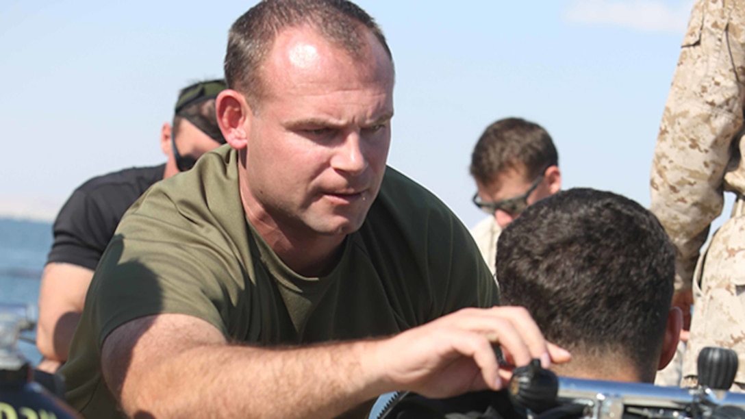 A U.S. Marine with the Force Reconnaissance detachment, 11th Marine Expeditionary Unit, is inspected by the dive supervisor before conducting a sustainment dive, Jan. 2, 2014. The 11th MEU is deployed with Makin Island Amphibious Ready Group as a theater reserve and crisis response force throughout U.S. Central Command and 5th Fleet area of responsibility. (U.S. Marine Corps photo by Cpl. Evan R. White/ Released)