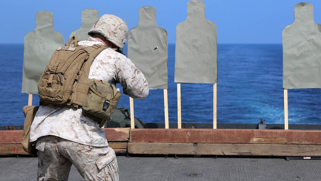 Sgt. Jonathan Roche, a communication electronics technician with Combat Logistics Battalion 11, 11th Marine Expeditionary Unit, from Chicago, engages a target during an advanced combat marksmanship program shoot on the flight deck of the dock landing ship USS Comstock, Jan. 5. The 11th MEU is deployed with the Makin Island Amphibious Ready Group as a theater reserve and crisis response force throughout U.S. Central Command and the U.S. 5th Fleet area of responsibility. 