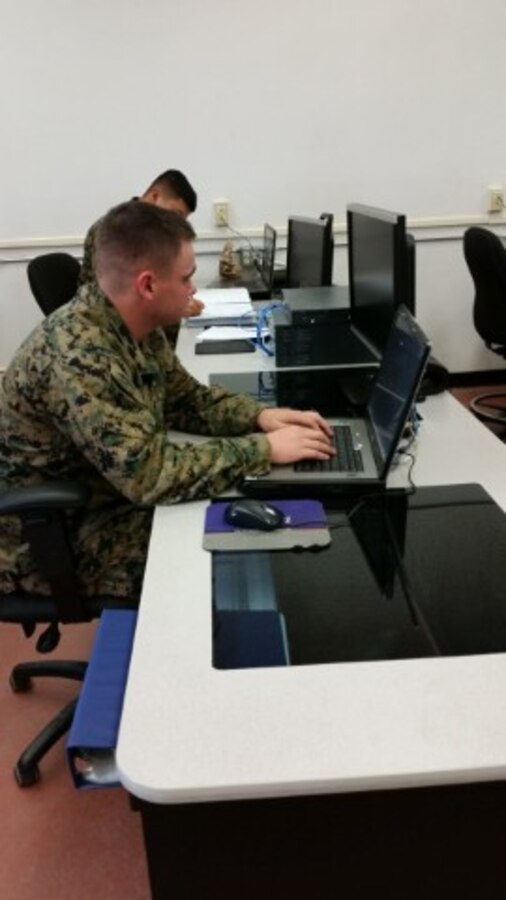 LCpl William S. Wood from Tactical Data Systems Administrator Course 2015010 is configuring a Catalyst 3750 Switch to communicate with other networking devices. He has been training on this gear for a week learning everything from basic terms to configuring access control lists and other security measures.