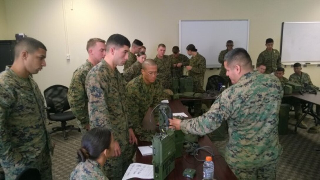 Sgt Savino G. Martinez, Delta Company, Communications School is introducing the 7800R Radio Remote Control System and showing proper utilization.