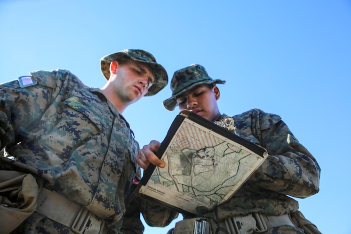 Recruits Shayne Braunlich and Ashton R. Collins, (left to right) Platoon 1023, Bravo Company, 1st Recruit Training Battalion, find their way to their next point during the Land Navigation Course at Edson Range, Marine Corps Base Camp Pendleton, Jan. 6. During recruit training, recruits learn how to take charge and lead each other both using confidence and leadership traits that they learn in various events. Events like Land Navigation allow recruits to practice those skills. Braunlich is a native of Aurora, Colo., and was recruited out of Recruiting Substation Aurora Metro East, Colo. Collins is a native of Mission Viejo, Calif., and was recruited out of Recruiting Substation Tustin, Calif.