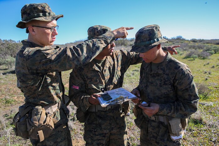Recruits of Bravo Company, 1st Recruit Training Battalion, work together to find their way to their next point during the Land Navigation Course at Edson Range, Marine Corps Base Camp Pendleton, Jan. 6. Each navigation point is marked with a numbered ammunition can. Each pair of recruits was given a different route to follow.