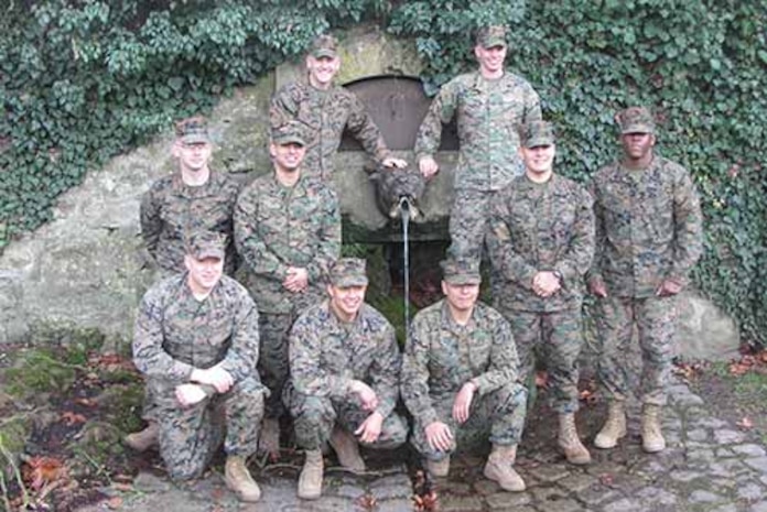 The photo was taken at the reenlistment ceremony.  As you can see, all the Marines are standing at the famous Devil Dog fountain
