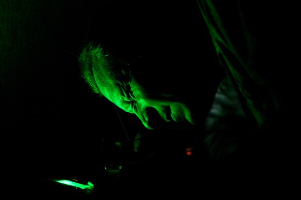 Master Sgt. Jeremy Jacobs does a function check on night vision goggles Dec. 1, 2014, while TDY to Chile. Jacobs was the team lead for a four-week training session that took place in Chile, which focused on perfecting maintenance procedures and the use of night vision goggles. Jacobs is a tactical aircraft manager with the 12th Air Force (Air Forces Southern). (U.S. Air Force photo/Staff Sgt. Adam Grant)