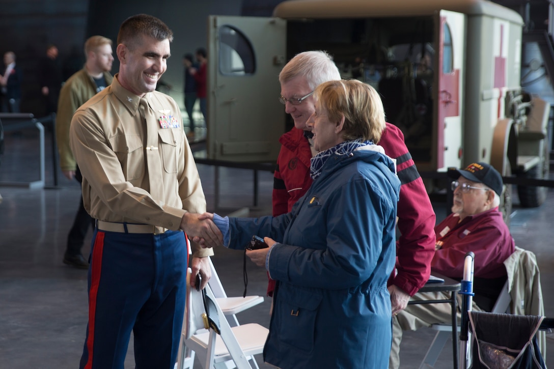 Col. Steven G. Godinho, commanding officer of Headquarters Battalion, 
Marine Forces Reserve, speaks to a couple attending the Mayor’s Challenge to End Veteran Homelessness press conference at the National World War II Museum in New Orleans, Jan. 7, 2015. The press conference was open to the public and had representatives from each military branch present.(U.S. Marine Corps photo by Lance Cpl. Ian Ferro)
