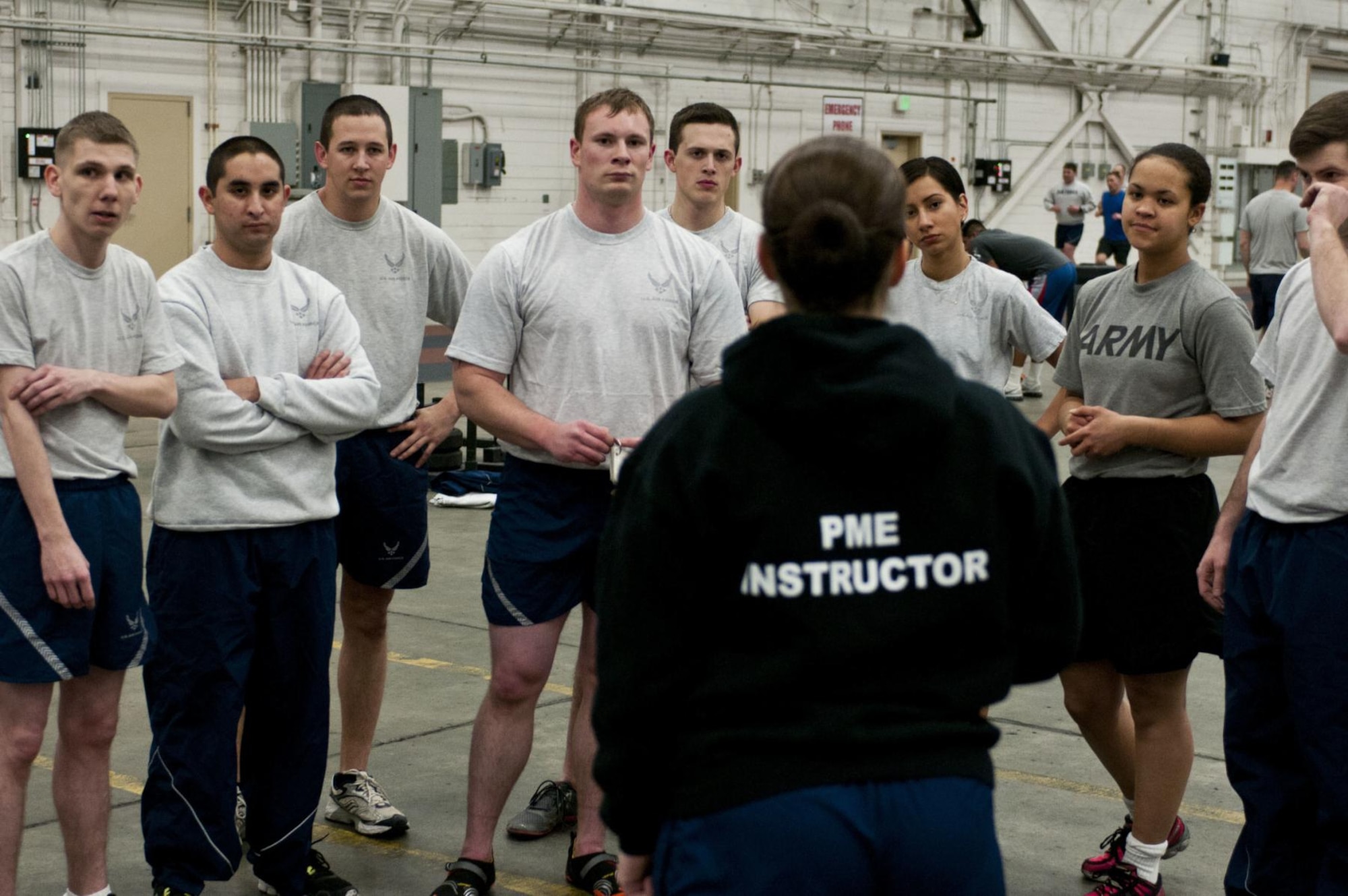 U.S. Army Cpl. Janay Nutter participates in Air Force physical training during Airman Leadership Course class 15-1 Dec. 3, 2014, at Joint Base Elmendorf-Richardson, Alaska. Nutter is a radio retransmission squad leader with 2nd Platoon, C. Company, 6th Brigade Engineer Battalion, 4th Infantry Brigade Combat Team (Airborne), 25th Infantry Division. (U.S. Army photo/Staff Sgt. Daniel Love)