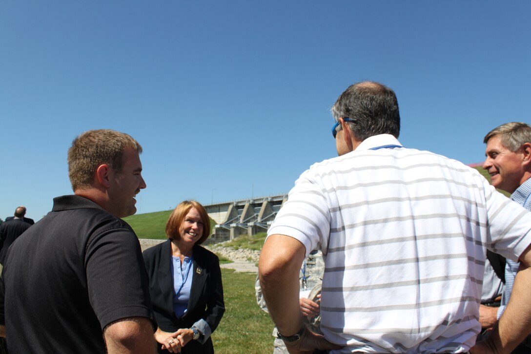 Assistant Secretary of the Army (Civil Works) Jo Ellen Darcy talks with District employees Anthony Heddlesten, Jim Bartek, Roger Less and District Commander Col. Mark Deschenes about the Red Rock Hydroelectric Project.