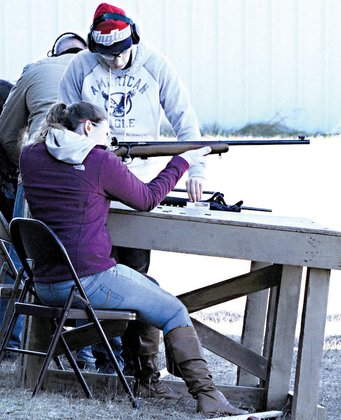 Megan, 17, fires her father’s M-1 Garand rifle during a recreational firing session aboard Marine Corps Base Quantico. 