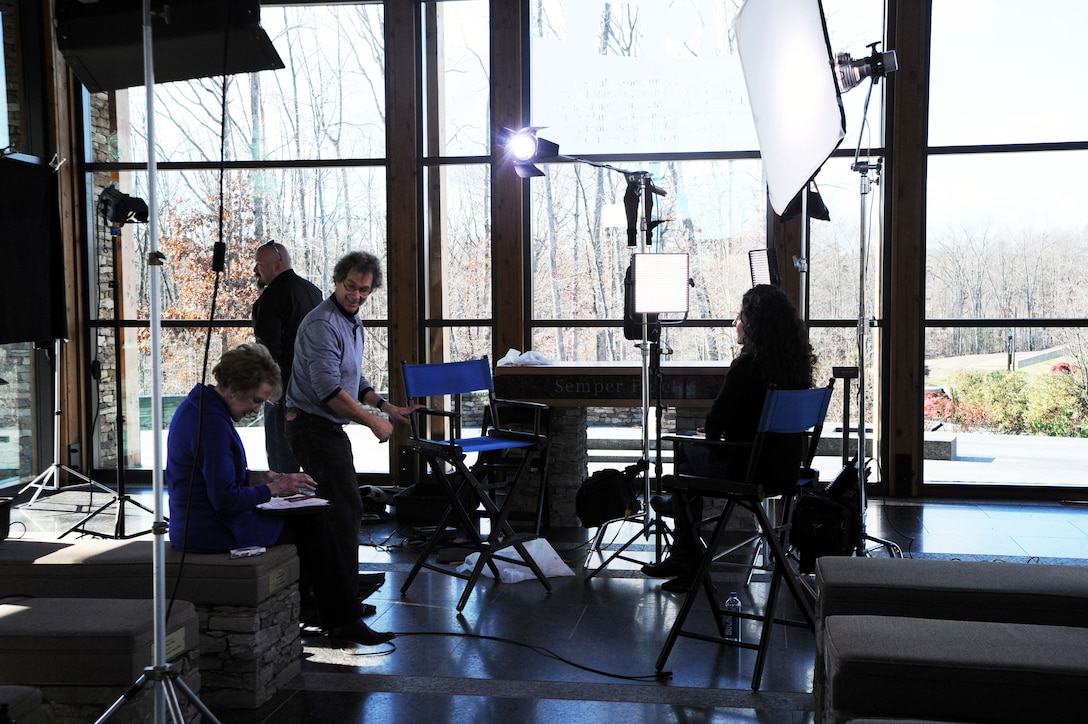 NewsHour anchor Margaret Warner, producer Morgan Till and cameraman Murray Pinczuk prepare for the interview with Wardogs author Rebecca Frankel in the chapel of the National Museum of the Marine Corps on Dec. 17. The program aired on PBS on Dec. 23, 2014