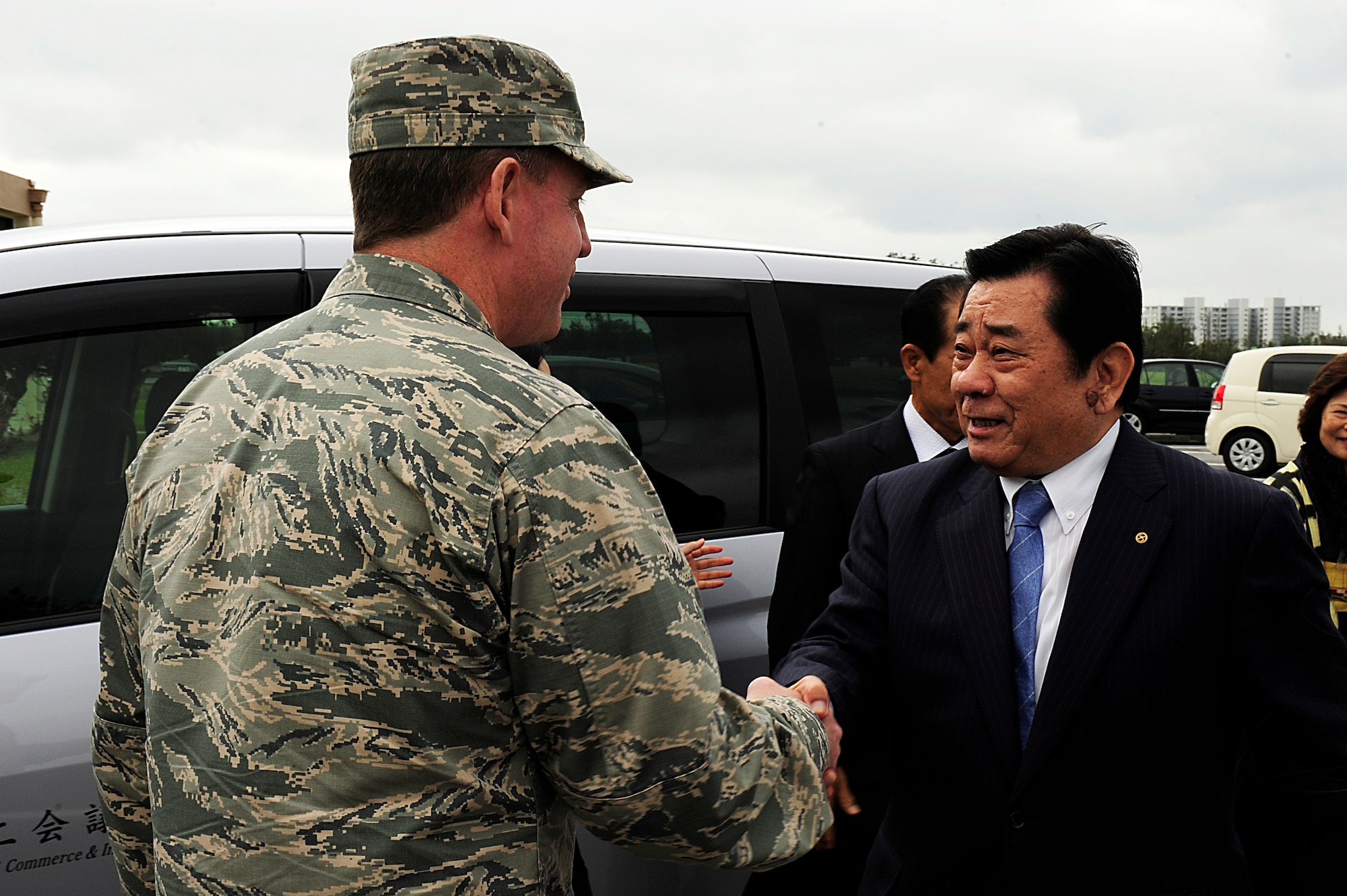 U.S. Air Force Brig. Gen. James Hecker, 18th Wing commander, meets with Naohiko Arakaki, Okinawa Chamber of Commerce chairman, during a visit on Kadena Air Base, Japan, Jan. 7, 2015. As part of Japanese tradition, local public office officials visit business-affiliated organizations and personnel at the beginning of each new year to wish them a happy and prosperous year. (U.S. Air Force photo by Senior Airman Maeson L. Elleman)