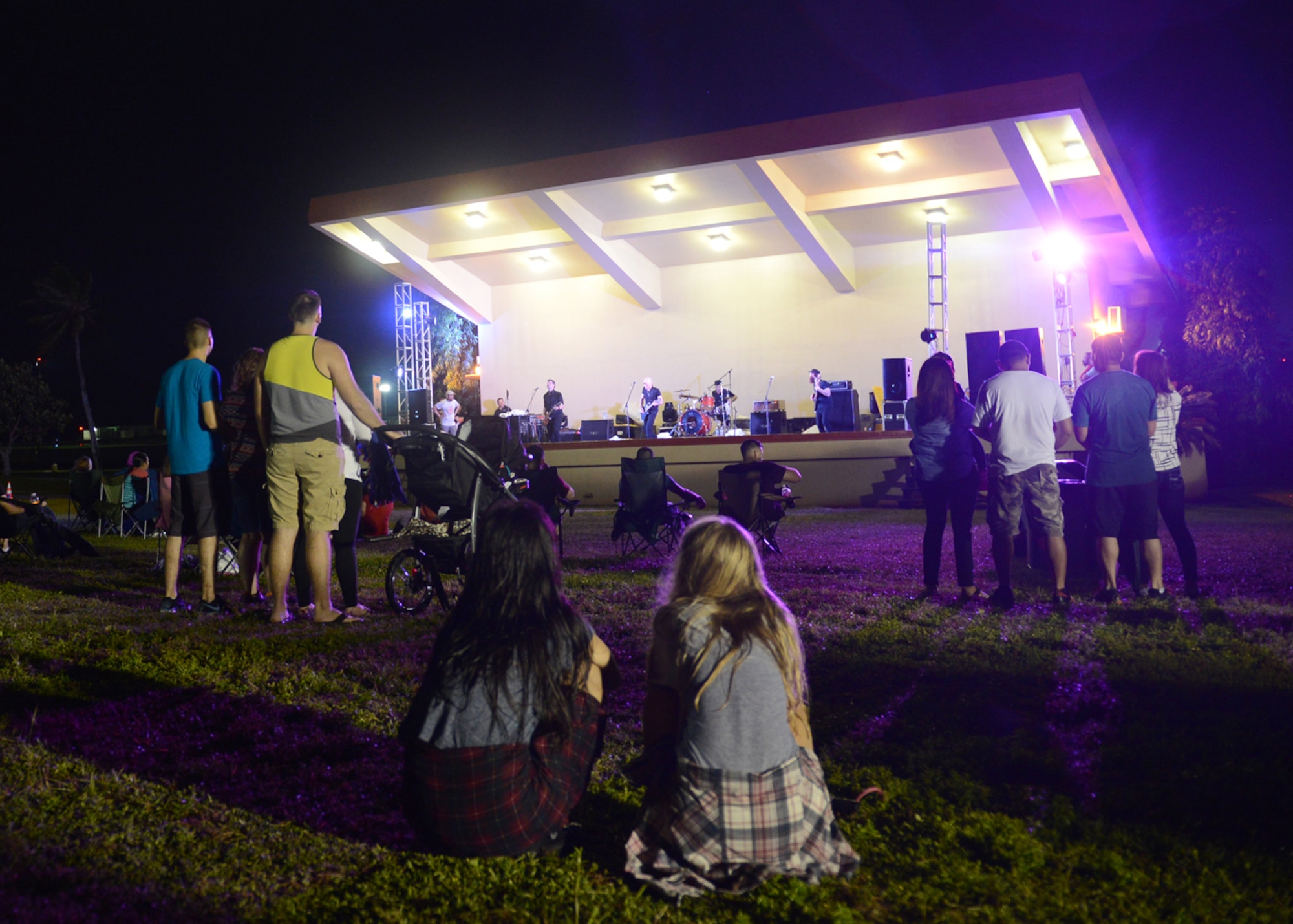 Team Andersen members watch alternative rock band Vertical Horizon play songs from their 1999 double platinum album, Everything You Want, Jan. 6, 2015, at the Arc Light Amphitheater at Andersen Air Force Base, Guam. The band played before military members and their families as part of a tour hosted by Armed Forces Entertainment taking them to several bases in the Pacific theater. (U.S. Air Force photo by Tech. Sgt. Zachary Wilson/Released.)