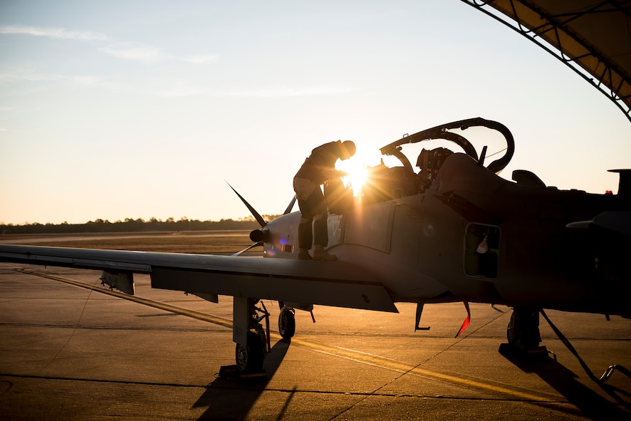An 81st Fighter Squadron pilot prepares the cockpit of an A-29 Super Tucano for a flight Jan. 8, 2015, at Moody Air Force Base, Ga. Afghan student pilots and maintainers are scheduled to begin training on the aircraft in February as part of the light air support training mission. (U.S. Air Force photo by Senior Airman Ryan Callaghan/Released)