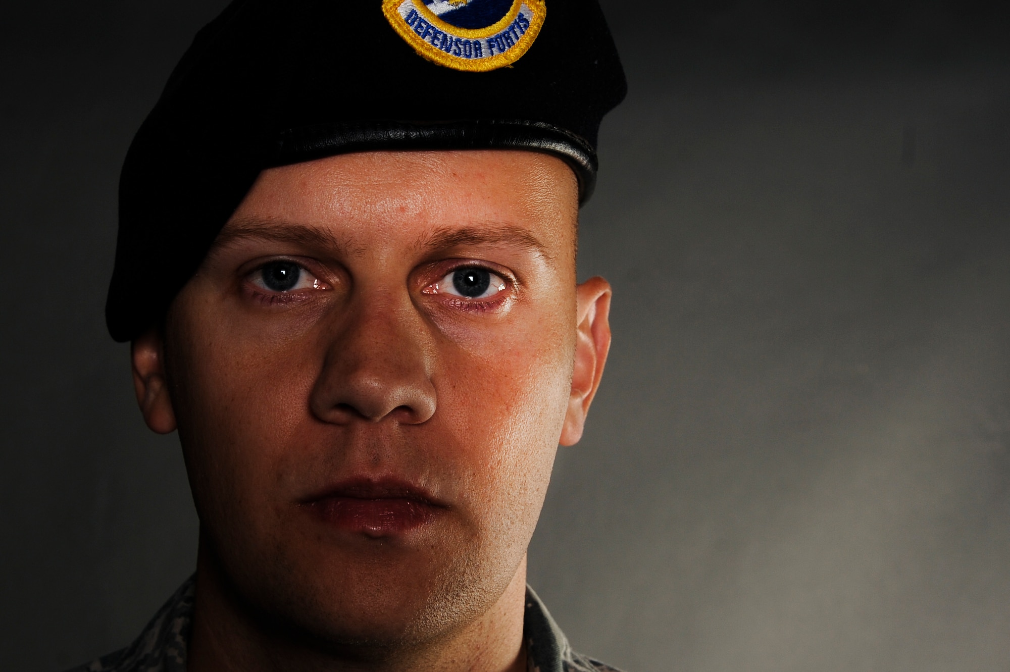 Master Sgt. Aaron Downing, a 19th Security Forces Squadron weapons and tactics superintendent, was struck by an improvised explosive device blast while riding in a convoy during his deployment to Iraq in 2007. In 2014, Downing was awarded a Purple Heart by Lt. Gen. Carlton Everhart, 18th Air Force Commander, for his wounds during his deployment to Iraq. (U.S. Air Force photo by Airman 1st Class Mercedes Muro)