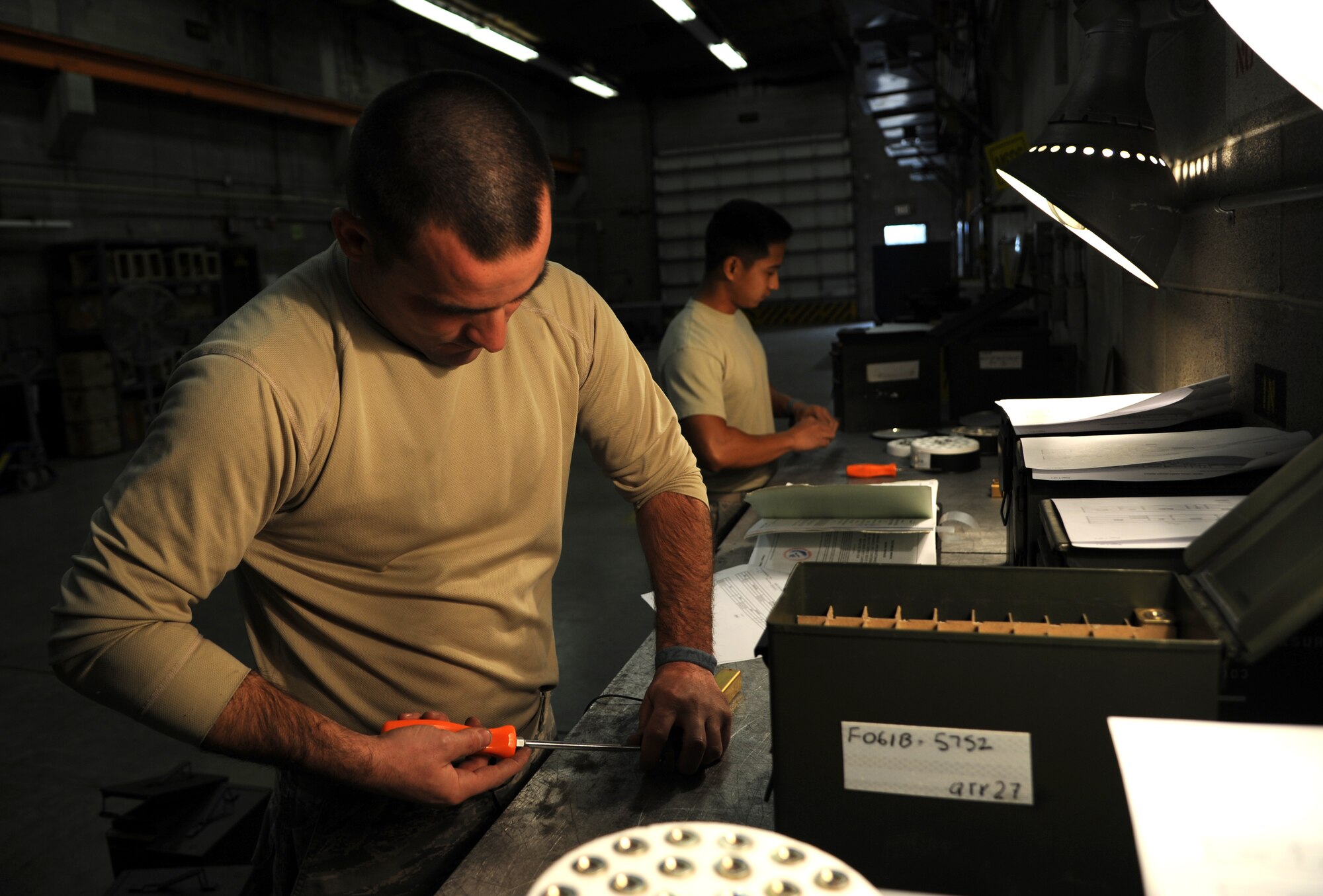 Staff Sgt. Michael Kohrs, a 19th Maintenance Squadron munitions flight stockpile surveillance crew chief, assembles M206 flares Dec. 11, 2014, at Little Rock Air Force Base, Ark. M206 flares are used for protection against heat seeking missiles on helicopters and low altitude aircraft such as the A-10 and C-130. (U.S. Air Force photo by Airman 1st Class Harry Brexel)