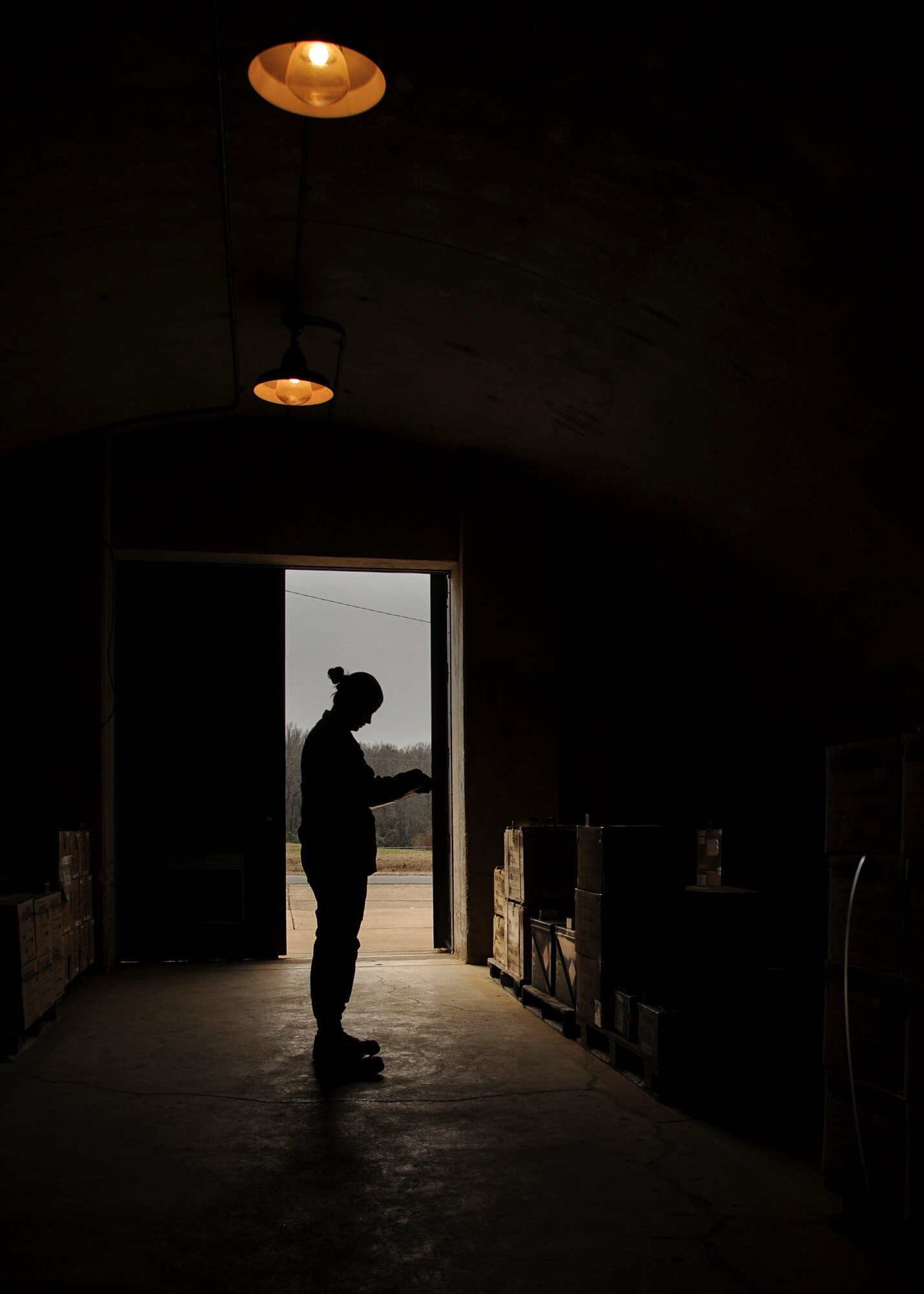 Airman 1st Class Sydney Vann, a 19th Maintenance Squadron munitions flight stockpile surveillance crewmember, inventories munitions inside a bunker Dec. 11, 2014, at Little Rock Air Force Base, Ark. The 19th MXS munitions flight assembles, inspects and stores more than 1,400 types of weapons and ammunitions. (U.S. Air Force photo by Airman 1st Class Harry Brexel) 