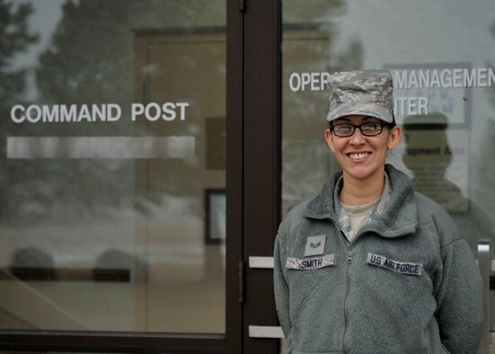 Senior Airman Maritza Smith, a 92nd Air Refueling Wing Command Post emergency action controller, stands outside of her building Jan. 7, 2015, at Fairchild Air Force Base, Wash. Smith runs checklists and answers phones to assist leaders with information to execute the base mission. Smith’s leadership selected her as a member of Team Fairchild’s elite, Fairchild’s Finest. (U.S. Air Force photo illustration/Airman 1st Class Taylor Bourgeous)
