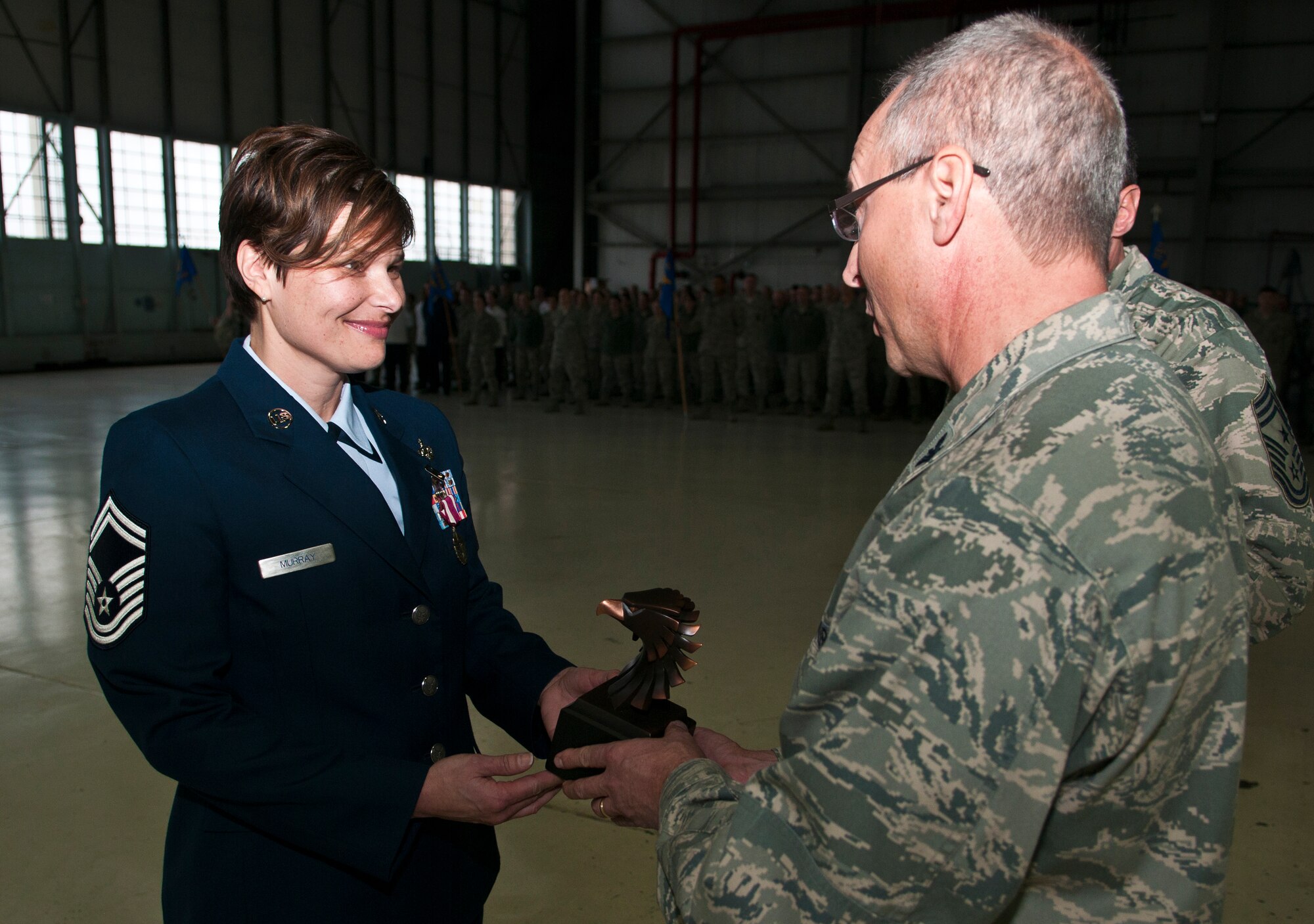 U.S. Air Force Senior Master Sgt. Julie Murray accepts the Richard L. Boggs Leadership Award at an awards formation, Rickenbacker Air National Guard Base, Ohio, Dec. 13, 2014. (U.S. Air National Guard photo by Tech. Sgt. Zachary Wintgens/Released)