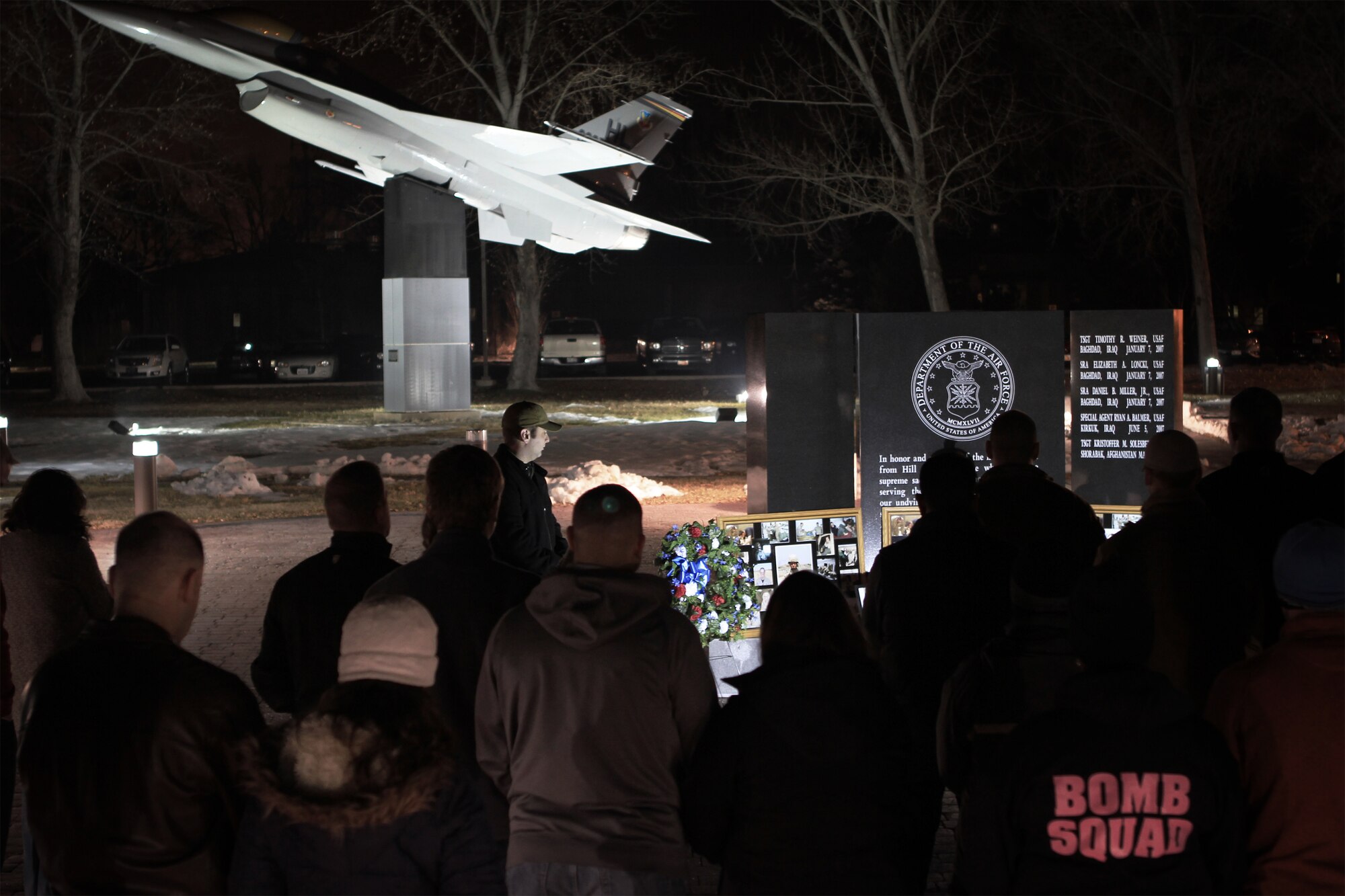 Hill’s 775th Explosive Ordnance Disposal Flight held a ceremony Jan. 7 at the Hill AFB Memorial Park to remember the fallen Airmen of Team Lima – Tech. Sgt. Timothy Weiner, Senior Airman Daniel Miller, and Senior Airmen Elizabeth Loncki. A few minutes before 9 p.m., members of Team Hill gathered at the Memorial Park where the chaplain spoke a few words and then the group stood in silence until Taps played. “Greater love has no man than this, that he lay down his life for his friends,” said the Chaplain.  The three Airmen, all from Hill AFB, were killed investigating a vehicle-born explosive device near Al Mahmudiyah, Iraq, Jan. 7, 2007 when it detonated. (Air Force Photo by Micah Garbarino)