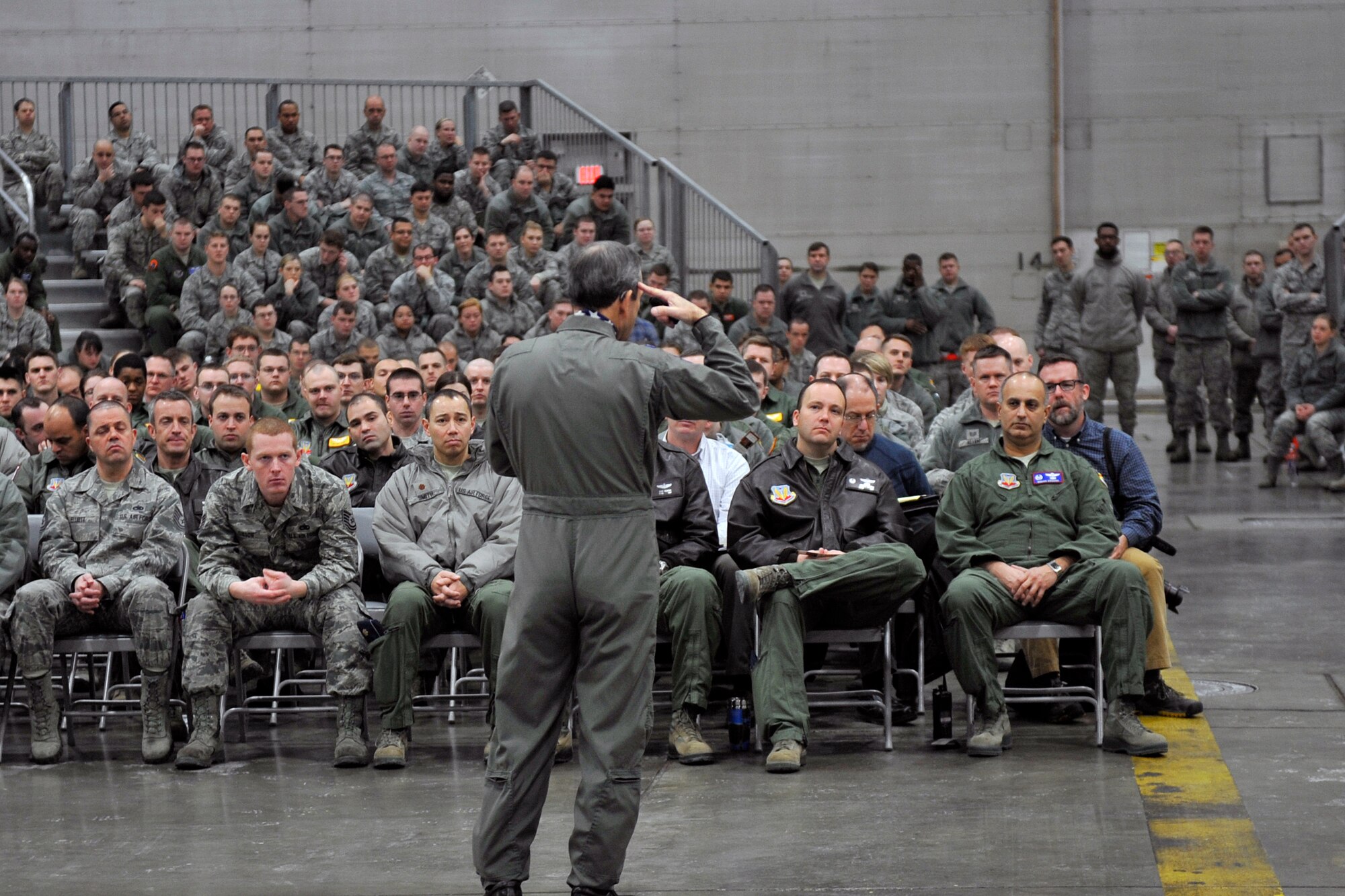 Retired U.S. Air Force Col. Lee Ellis, who is a former prisoner of war and author of the book, ‘Leading with Honor,’ speaks to Airmen gathered inside an aircraft hangar at Offutt Air Force Base, Neb. Jan. 5, 2015. Ellis spoke about his experience as a prisoner of the Vietnam War, and the lessons he learned in resiliency and leadership. (U.S. Air Force photo by Jeff W. Gates/Released)