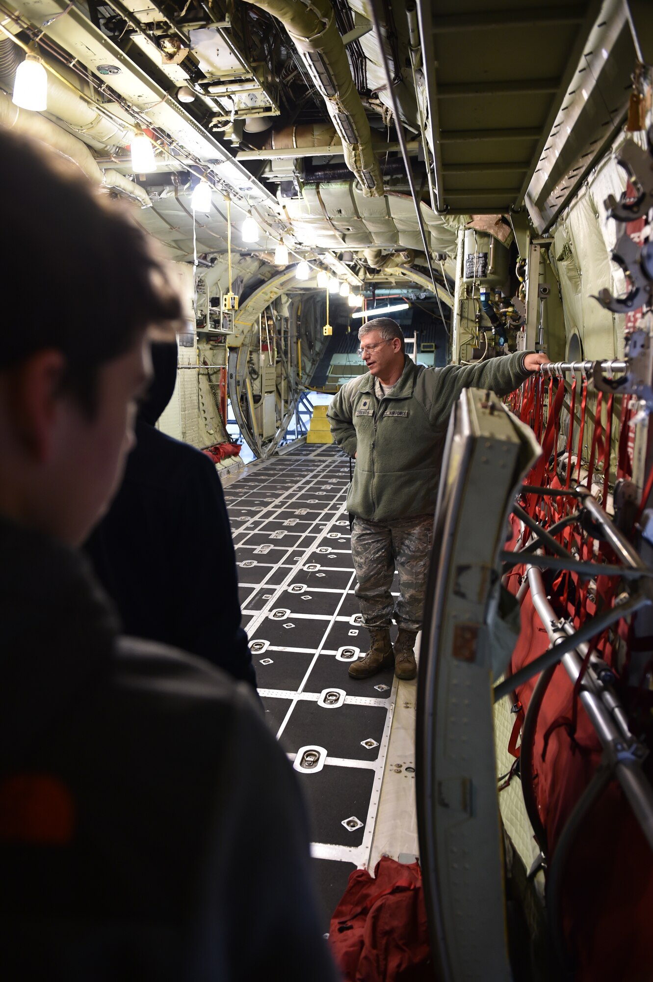 Lt. Col. Bob Griffith, 910th Airlift Wing Maintenance Squadron commander, talks to students from Cuyahoga Valley Christian Academy inside the cargo area of C-130H Hercules aircraft here, Jan. 7, 2015. Approximately 12 students from the school came to Youngstown Air Reserve Station for an educational visit as part of their career week emphasizing military and service careers. U.S. Air Force photo/Eric M. White.