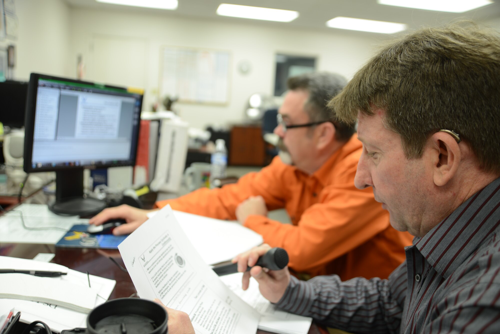 Robert D. Clapp, 22nd Air Refueling Wing ground safety manager, discusses risk management briefing during a web conference with George Maher, 22nd ARW weapon safety manager, on Defense Connect Online for the 22nd Mission Support Group, Jan. 6, 2015, at McConnell Air Force Base, Kan. Safety-down day was held to provide McConnell Airmen information on how to prevent and identify possible hazards at home and at work. (U.S. Air Force photo/ Staff Sgt. Alexander S. Farver)