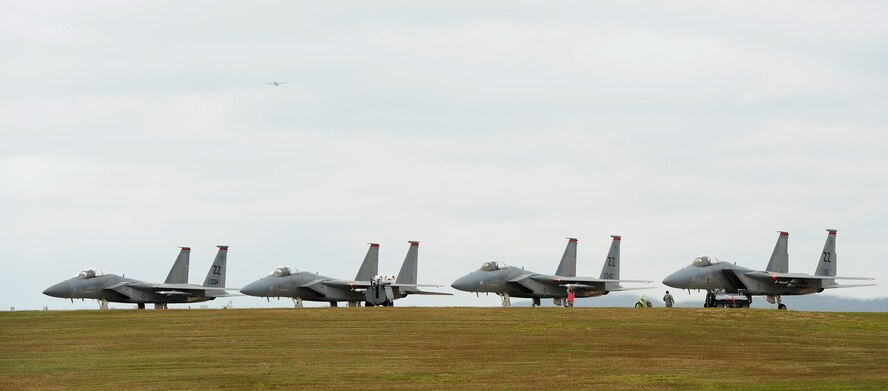 Four U.S. Air Force F-15C Eagles from the 67th Fighter Squadron sit on the flightline between sorties during a training surge on Kadena Air Base, Japan, Jan. 7, 2015. The purpose of training surges is to increase the number of flying hours each day during a set period of time with the goal of increasing power proficiency and ensuring combat readiness. (U.S. Air Force photo by Airman 1st Class Zade C. Vadnais)