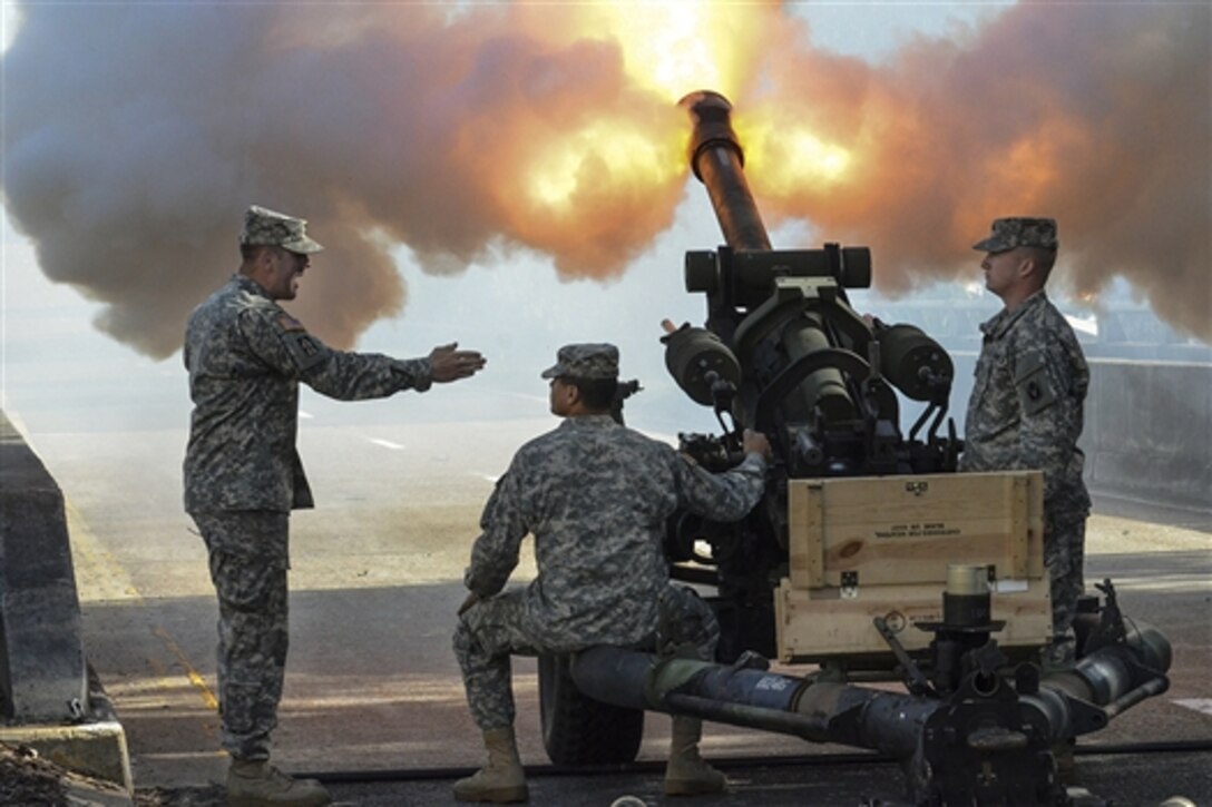 Soldiers fire a 105 mm howitzer during the inauguration ceremony for Florida Gov. Rick Scott at the Old Capitol in Tallahassee, Fla., Jan. 6, 2015. The soldiers are assigned to Florida Army National Guard's 2nd Battalion, 116th Field Artillery Regiment. Fifteen soldiers from the unit provided a 19-gun salute.  