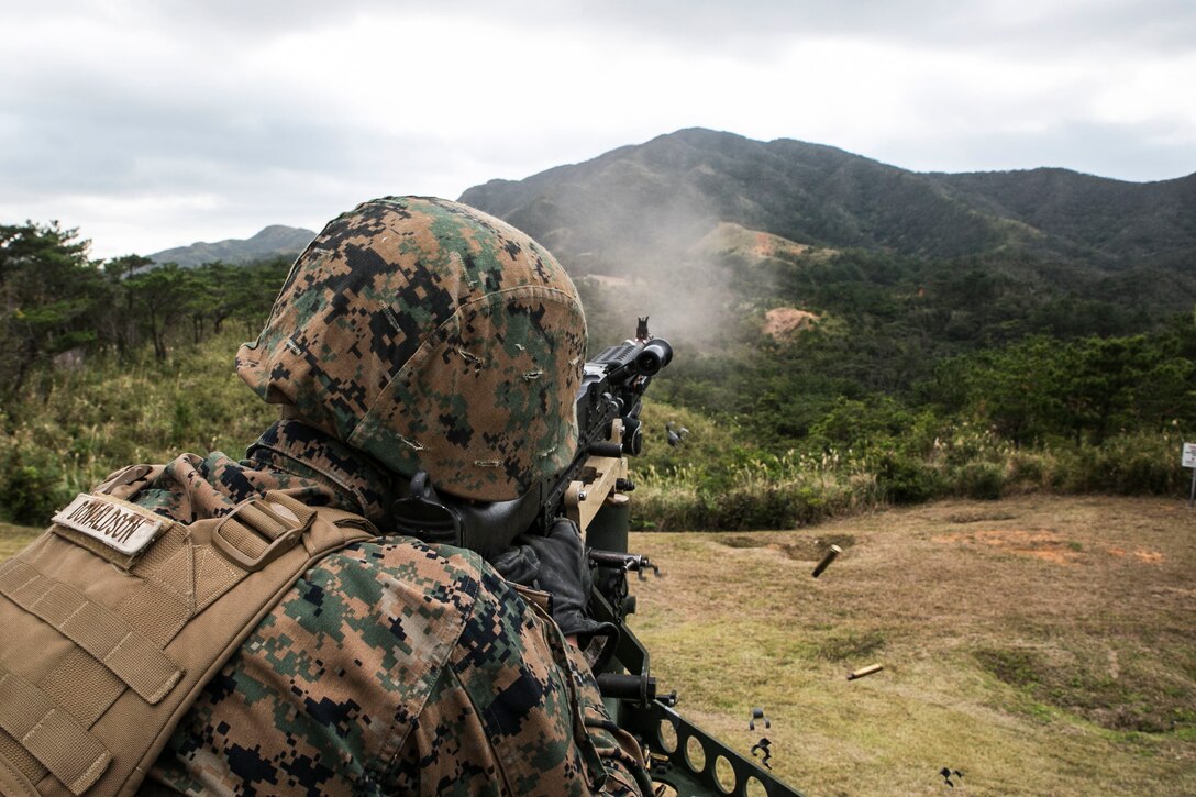 Pfc. Zachary T. Donaldson fires an M240B medium machine gun from a 7-ton truck during training Jan. 7 at Range 9 in the Central Training Area. The motor transport Marines studied the fundamentals of the medium machine gun to prepare for the upcoming Integrated Training Exercise 15-2 at Marine Corps Air Ground Combat Center in Twentynine Palms, California. Donaldson, from Bradenton, Florida is a motor vehicle operator with Truck Company, Headquarters Battalion, 3rd Marine Division, III Marine Expeditionary Force.