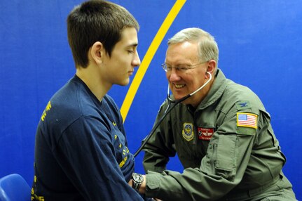 Col. Cory Strobel, chief of aeromedical services for the 134th Medical Group from McGhee Tyson Air National Guard Base, Tenn., conducts a physical on Alaskan native Matthew Rae, a seventeen-year-old Maniilaq High School student in Kotzebue, Alaska as part of Operation Artic Care 2010 on April 16, 2010. Rae needs the physical to medically qualify for sports at his school.