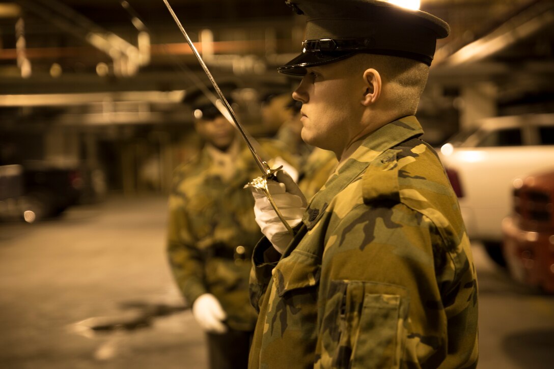 United States Marines practice sword manual during Ceremonial Drill School at Marine Barracks Washington, D.C., Jan. 8, 2015 (U.S. Marine Corps photo by Lance Cpl. Christian J. Varney/Released)