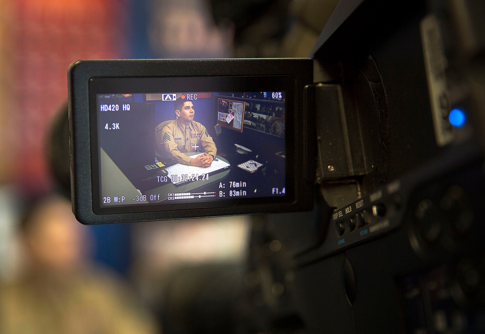 LYNWOOD, Wa. -- Sgt. Ricardo Schebesta, a Marine recruiter in Lynnwood, Washington, speaks on camera with KING 5 News reporter Eric Wilkinson Jan. 7, 2015, about his role in preventing a robbery outside the office Jan. 6. After hearing shouting and honking outside their office, Schebesta and Staff Sgts. Ben Shoemaker and Bryson Twigg responded to a situation in which two young men attempted to rob an elderly woman. Despite being told by the victim the suspects were armed with a gun, the Marines ran through rush-hour traffic to pursue them. Shoemaker subdued one of the suspects using a wrist lock, a technique taught in the Marine Corps Martial Arts Program, and held the suspect until police arrived to arrest him. Police retrieved a metal bat from the suspect’s pants but have not yet located his accomplice. Schebesta is from Anaheim, California. Shoemaker is from Spokane, Washington. Twigg is from Akron, Ohio. (U.S. Marine Corps photo by Sgt. Reece Lodder)