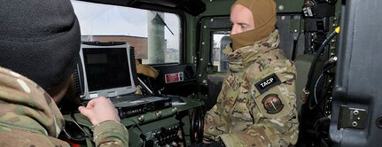 The 181st Intelligence Wing, 113th Air Support Operation Squadron members perform voice and data connectivity checks during an exercise Jan. 7, 2015, Hulman Field, Terre Haute, Ind. The no-notice exercise demonstrated domestic response capabilities highlighting the Unit’s ability to pass critical information without the use of cell phones or landlines at beyond line-of-sight distances. (Photo by Senior Master Sgt. John S. Chapman/Released)