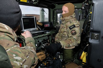 The 181st Intelligence Wing, 113th Air Support Operation Squadron members perform voice and data connectivity checks during an exercise Jan. 7, 2015, Hulman Field, Terre Haute, Ind. The no-notice exercise demonstrated domestic response capabilities highlighting the Unit’s ability to pass critical information without the use of cell phones or landlines at beyond line-of-sight distances. 