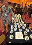 Deployment stickers for Iraq and Afghanistan are left out for Air National Guard civil engineers at the Civil Engineer and Security Forces Conference in Phoenix April 19-23, 2010. Across the country, thousands of construction and repair experts are in the midst of overseas deployments in historic numbers and scope. While whole units are deploying, leaving bases to manage in their absence, mobilization officials report improvements in notifications as well as in benefits.