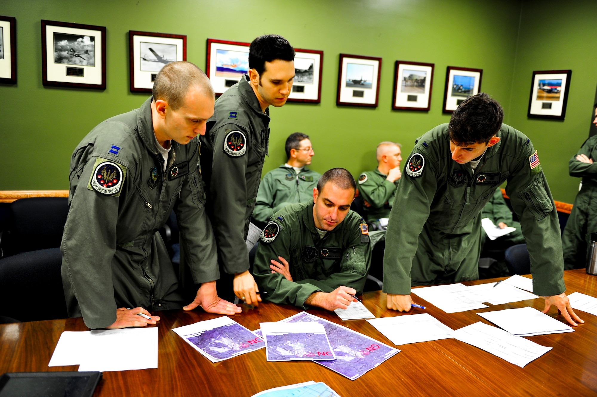 Members from the 15th Special Operations Squadron go over flight plans at Hurlburt Field, Fla., Jan. 7, 2014. The crew planned a high-altitude low-opening jump for members from the 24th Special Operations Wing. (U.S. Air Force photo/Senior Airman Christopher Callaway) 