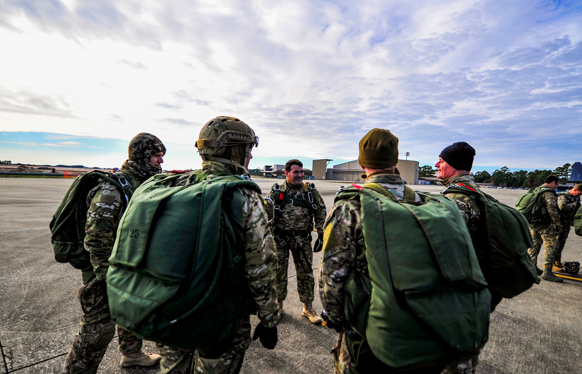 A group of Special Tactics Airmen from the 24th Special Operations Wing review proper procedures of a high-altitude low-opening jump at Hurlburt Field, Fla., Jan. 7, 2014. A group of 16 members teamed up with an MC-130H Talon II crew to jump from 10,000 feet to train for alternate insertion into hostile or austere environments. (U.S. Air Force photo/Senior Airman Christopher Callaway) 