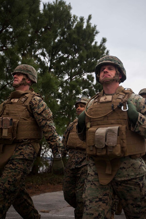 U.S. Marine Corps Gunnery Sgt. Trevor Nelson, right, 22nd Marine Expeditionary Unit logistics chief and native of Lewiston, Minn., marches in a five-mile unit hike at Marine Corps Base Camp Lejeune, N.C., Jan. 9, 2015. The unit conducted the hike to maintain unit readiness and build morale. (U.S. Marine Corps photo by Sgt. Austin Hazard/Released)