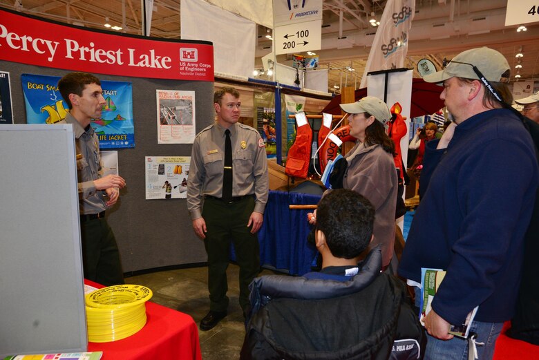 U.S. Army Corps of Engineers Nashville District Park Ranger Charlie Leath from the Old Hickory Lake (left) and Park Ranger Noel Smith from J. Percy Priest Lake (right) talk with Sherry, Mark and son Christian Scobee at the Nashville Boat & Sportshow on Thursday, Jan. 8, 2015 in Music City Center.   Boating enthusiasts attending the 29th annual Nashville Boat & Sportshow at Music City Cener are encouraged to navigate to the Corps of Engineers booth to get important information about local lakes before embarking on the water this recreation season.  
