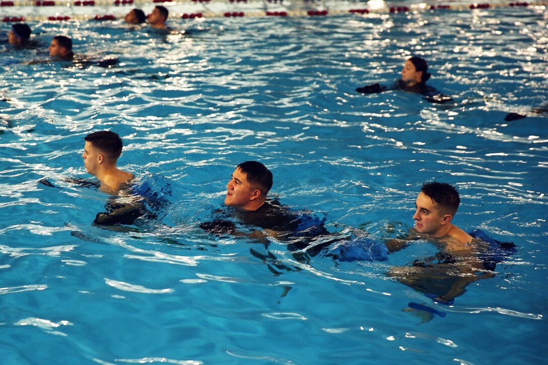 Marines with Marine Wing Communications Squadron 28 run in water during an Aquatic Maximum Power Intensity Training class at Marine Corps Air Station Cherry Point, N.C., Jan. 7, 2015. Running in water increases the Marines' endurance without any added pressure on their joints.