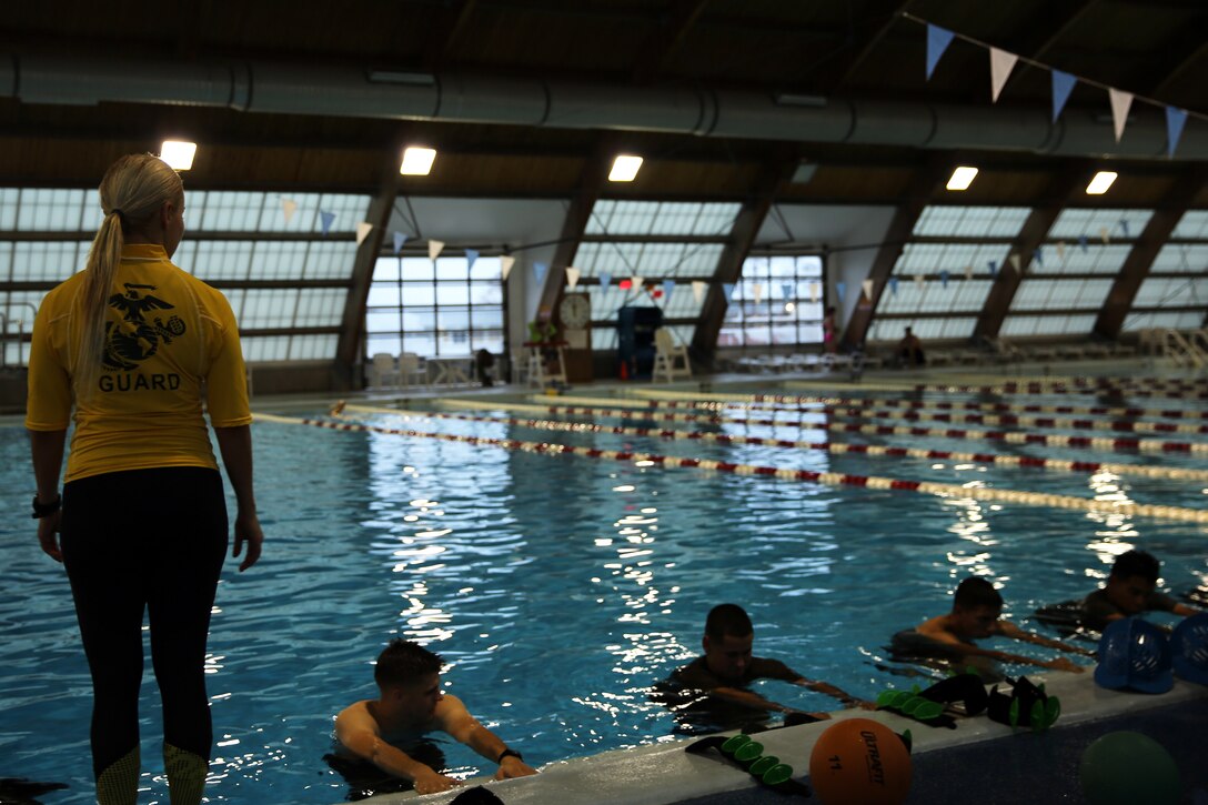 Veronica Laguna gives instructions during an Aquatic Maximum Power Intensity Training class at Marine Corps Air Station Cherry Point, N.C., Jan. 7, 2015. Active duty service members can attend the hour-long course for free to improve endurance and flexibility. Laguna is an aquatics fitness instructor with Semper Fit at Cherry Point and a native of Los Angeles.